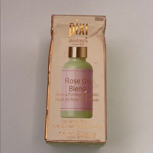 NIB PIXI ROSE OIL BLEND.